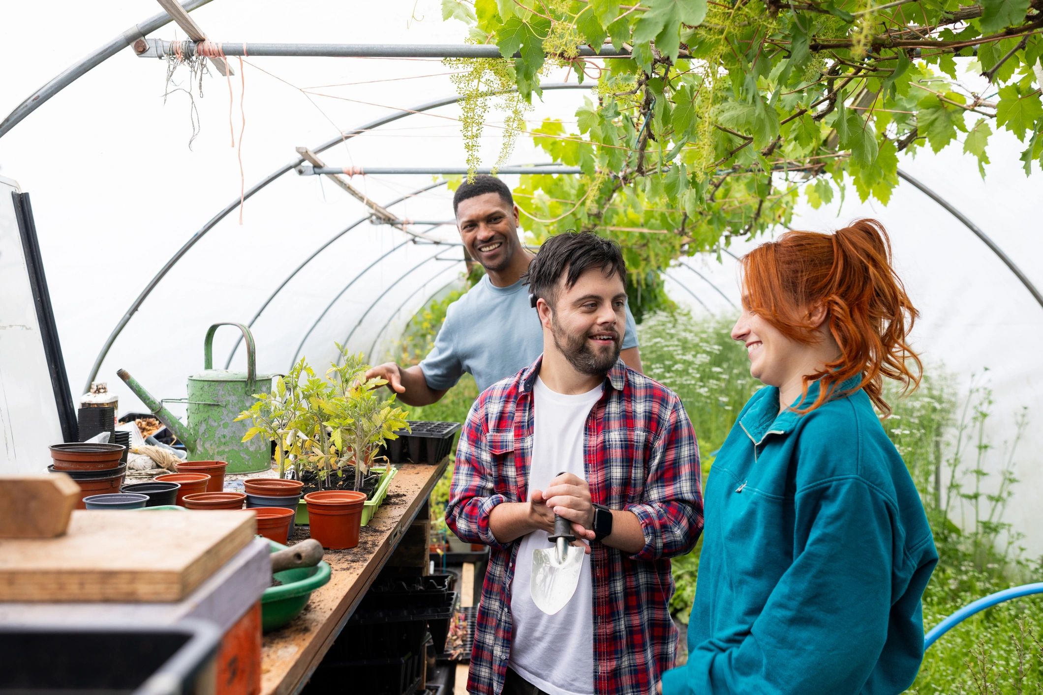 Agriculture team member in a greenhouse environment